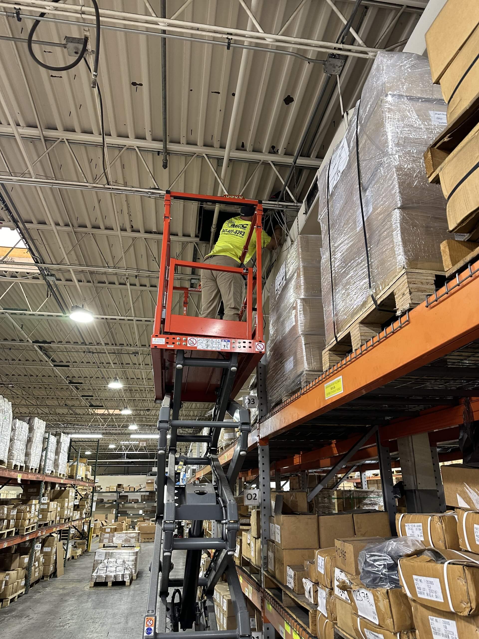 Warehouse lighting and electrical work from a lift